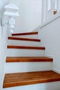 Luxury custom built home interior. Stunning two story entrance foyer design with white wainscoting, grey walls and a staircase Royalty Free Stock Photo