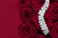 Luxury diamond jewelry bracelet and red roses flowers, love gift on Valentines Day and jewellery brand holiday background design Royalty Free Stock Photo