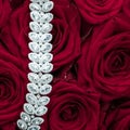 Luxury diamond jewelry bracelet and red roses flowers, love gift on Valentines Day and jewellery brand holiday background design Royalty Free Stock Photo