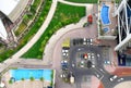 Luxury district aerial view. Modern living district with pool area, parking zone, sidewalks and green zone Royalty Free Stock Photo