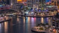 Luxury Dubai Marina canal with passing boats and promenade day to night timelapse, Dubai, United Arab Emirates Royalty Free Stock Photo