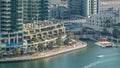 Luxury Dubai Marina canal with passing boats and promenade timelapse, Dubai, United Arab Emirates