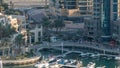 Luxury Dubai Marina canal with passing boats and promenade timelapse, Dubai, United Arab Emirates