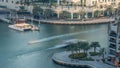 Luxury Dubai Marina canal with passing boats and promenade timelapse, Dubai, United Arab Emirates