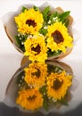 Luxury elegance beautiful bouquet made of fresh bright yellow sunflowers and green leaves Royalty Free Stock Photo