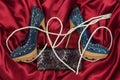 Luxury elegant denim shoes, lacquer purse and white beads, lying on red silk Royalty Free Stock Photo