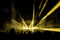 Yellow laser show nightlife club stage with party people crowd Royalty Free Stock Photo