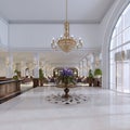 Luxury entrance in classic hotel with a large bouquet of flowers and a large golden chandelier Royalty Free Stock Photo