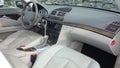 Luxury expensive cream leather interior of a german sedan car - front right corner view