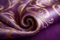 Luxury fabric in shades of purple and gold in royal theme. Royalty Free Stock Photo