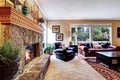 Luxury family room with cozy stone trimmed fireplace