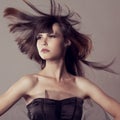 Luxury fashion model with flying hair. Beautiful fashionable girl. Stylish trendy woman