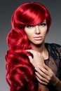 Luxury fashion trendy young woman with red curled hair. Girl w Royalty Free Stock Photo