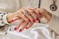 Luxury female hands with red manicure. Royalty Free Stock Photo