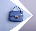 Luxury female top-handle bag in royal blue leather with a metal clasp Royalty Free Stock Photo