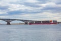 Luxury four-deck river cruise ship `Mustai Karim` on the Volga River. Automobile bridge between the cities of Saratov and Engels