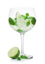 Luxury glass of Mojito summer alcoholic cocktail with ice cubes mint and lime on white with raw lime Royalty Free Stock Photo