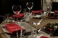 luxury glasses and plates with napkins on stylish decorated table at wedding reception. expensive catering at restaurant for Royalty Free Stock Photo