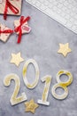 Luxury glitter numbers 2018 with keyboard and presents on grey concrete background Royalty Free Stock Photo