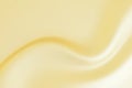 The luxury of gold fabric texture background. rippled light gold silk fabric, Cloth soft wave, Abstract gold cloth or liquid wave