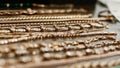 luxury gold jewelry chains, bracelets background, selective focus. Stylish beautiful bijouterie hanging on the stand in the