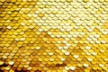 Luxury golden Background. Abstract Texture scales with gold Sequins close-up. Glamor Background with shiny Sequins on fabric, Royalty Free Stock Photo