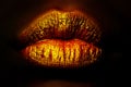Luxury golden lips. Woman mouth on black background. Dark love. Dark net. Prohibited content. Sexy lips. Girl kiss