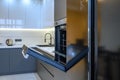 Luxury gray modern kitchen interior, oven's door opened
