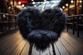 A luxury heart-shaped fur chair in front of a modern building