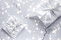 Luxury holiday gifts with white silk bow and ribbons on marble background, Christmas time surprise