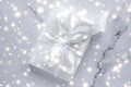 Luxury holiday gifts with white silk bow and ribbons on marble background, Christmas time surprise