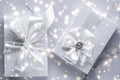 Luxury holiday gifts with white silk bow and ribbons on marble background, Christmas time surprise