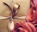 Luxury holiday golden gift box and bouquet of roses as Christmas, Valentines Day or birthday present Royalty Free Stock Photo
