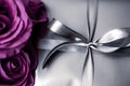 Luxury holiday silver gift box and purple roses as Christmas, Valentines Day or birthday present Royalty Free Stock Photo