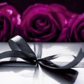 Luxury holiday silver gift box and purple roses as Christmas, Valentines Day or birthday present