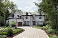 Luxury home with circular driveway Royalty Free Stock Photo