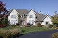 Luxury home with circular driveway Royalty Free Stock Photo