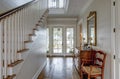 Luxury home entry foyer with view out onto waterfront property Royalty Free Stock Photo