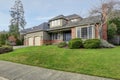 Luxury home exterior with three car garage. Royalty Free Stock Photo