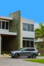 Luxury home with new SUV parked in the driveway Royalty Free Stock Photo
