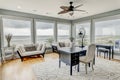 Luxury home office with large windows and a view of the ocean