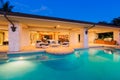 Luxury Home with Pool at Sunset Royalty Free Stock Photo