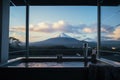 Luxury Hotel Bathtub at bath room with Fuji mountain background. Generative AI