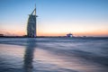 Luxury hotel Burj Al Arab and public beach at sunset. Dubai, UAE - 29/NOV/2016 Royalty Free Stock Photo