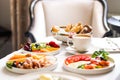 Luxury hotel and five star room service, various food platters, bread and coffee as in-room breakfast for travel and Royalty Free Stock Photo