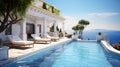 Luxury hotel with pool and view of Mediterranean Sea at sunset, Greece Royalty Free Stock Photo