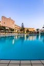 Luxury Hotel Resort with Swimming Poll Illuminated at Sunrise