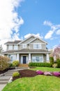 Luxury house with beautiful landscaping on a sunny day Royalty Free Stock Photo