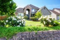 Luxury house exterior with brick and siding trim and double garage. Royalty Free Stock Photo