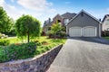 Luxury house exterior with brick and siding trim and double garage. Royalty Free Stock Photo